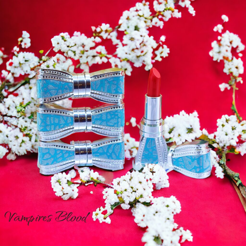 Elegant blue and gold perfume bottles with cherry blossoms on red background.