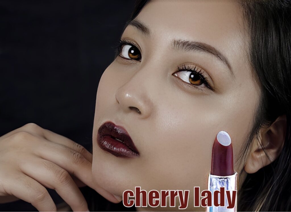 Close-up of a woman with glossy cherry red lipstick.