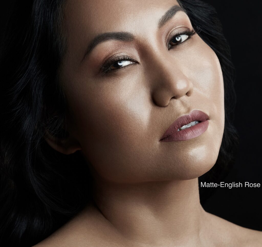 Close-up portrait of a woman with smooth skin and subtle makeup.