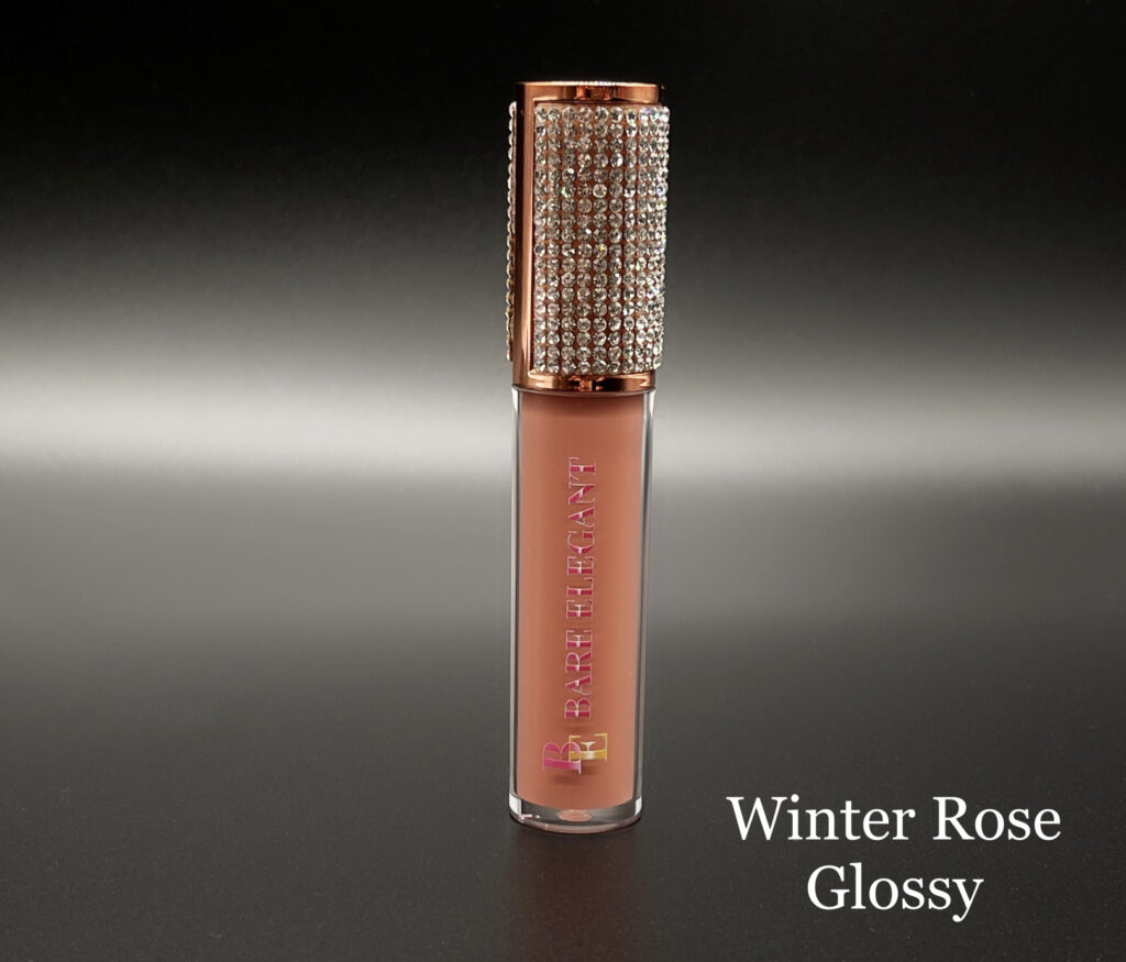A tube of Winter Rose Glossy lip gloss with a sparkling cap.