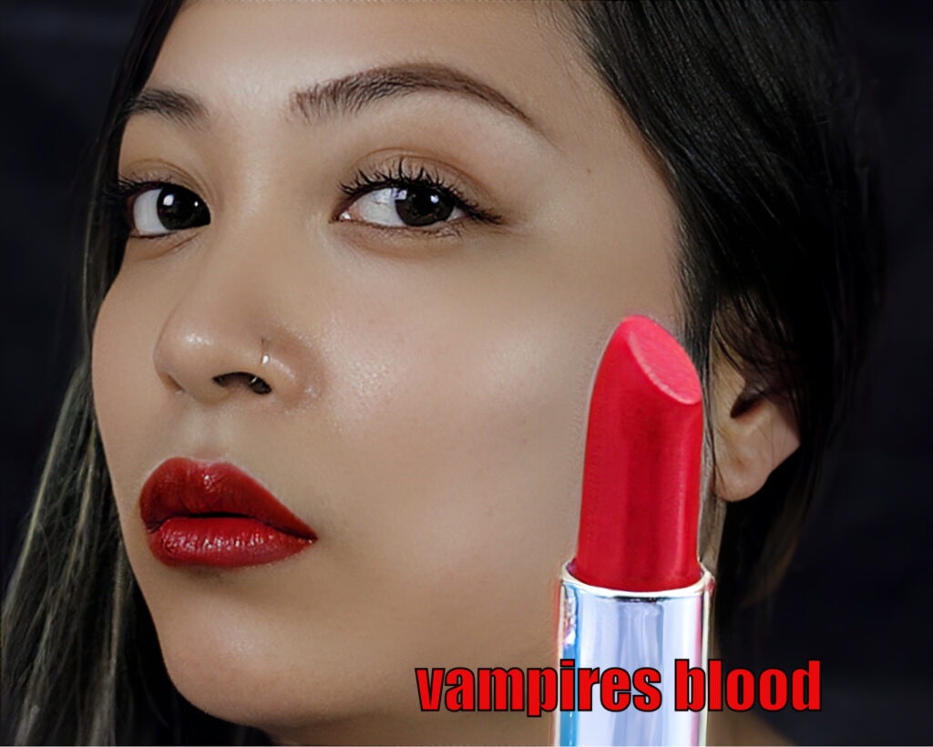 Close-up of a woman wearing bold red lipstick called 'vampires blood'.