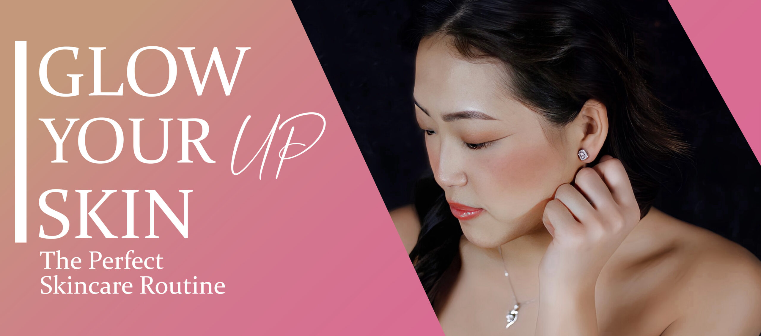 Woman with flawless makeup posing against a split pink and black background.